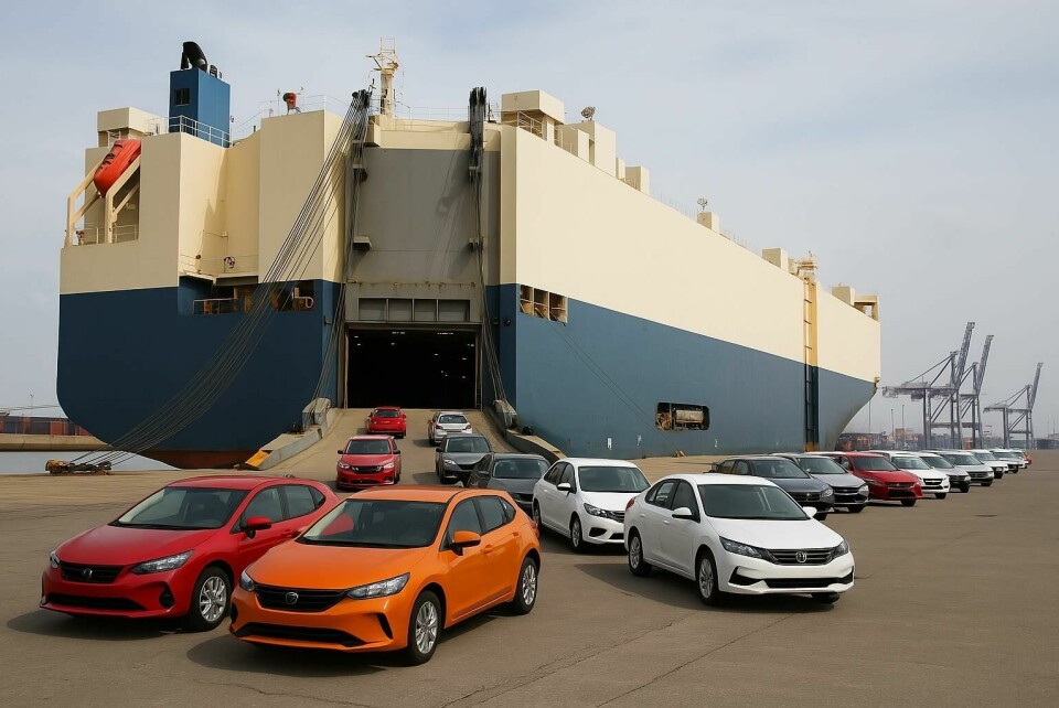 The race before the border closes, as auto logistics braces for a 25% tariff reckoning A large roll-on/roll-off cargo ship is docked at an industrial port, with multiple colour cars