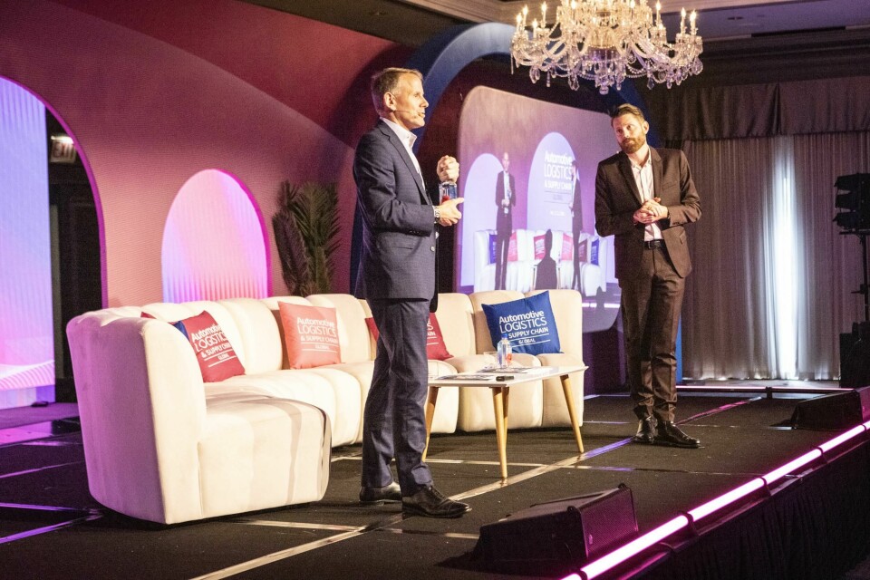 Mike Wall (left) stands beside Christopher Ludwig (right) to discuss the shift towards EVs in the automotive industry, focusing on adoption rates, production forecasts and the impact of government regulations. Mike Wall, S&P Global Mobility onstage alongside Christopher Ludwig at Automotive Logistics and Supply Chain Global 2024 conference