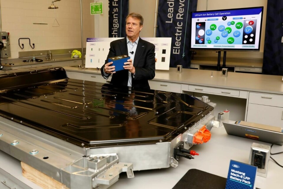 Ted Miller, manager at Ford Battery Cell Research and Advanced Engineering, holds a lithium iron phosphate battery during this week’s presentation Ford Battery 6
