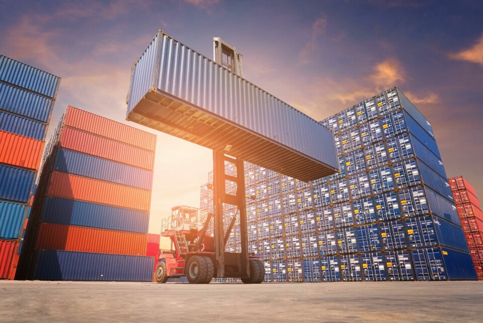 North America cross-border parts trade worth almost $170 billion hangs in the balance because of traiff threats by the US government shutterstock_container yard reach grabber