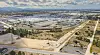 Aerial view of Volkswagen's Autoeuropa factory complex surrounded by roads and open land.