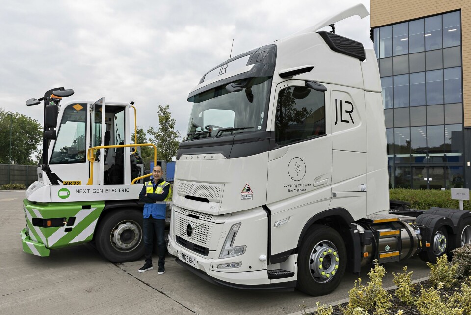 JLR’s Levent Yuksel with the OEM’s alternative fuel-powered trucks JLR's Levent Yuksel beside the carmaker's biomethane Electric trucks