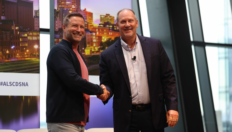 Jon Jacobson (left) and Kevin Piotrowski (right) seal the official launch of AIAG as Catena-X’s North American hub with a handshake