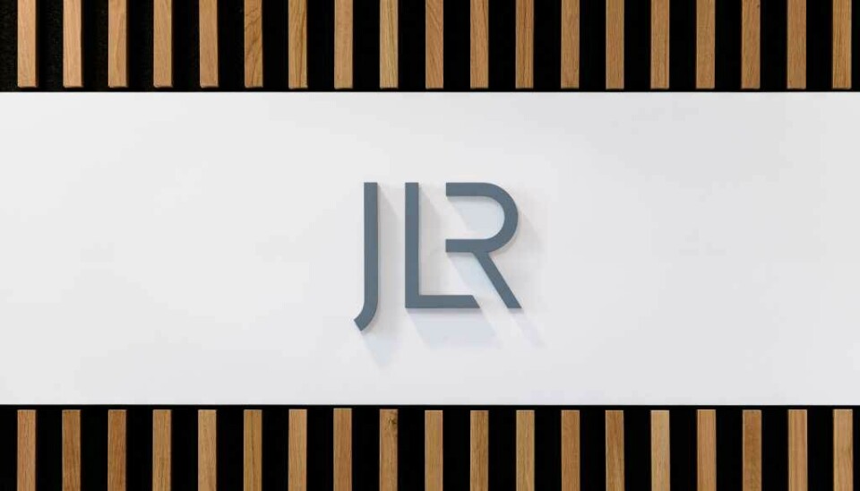 JLR profits halve due to US tariffs